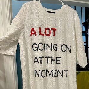 Taylor Swift “a lot going on at the moment” sequin dress